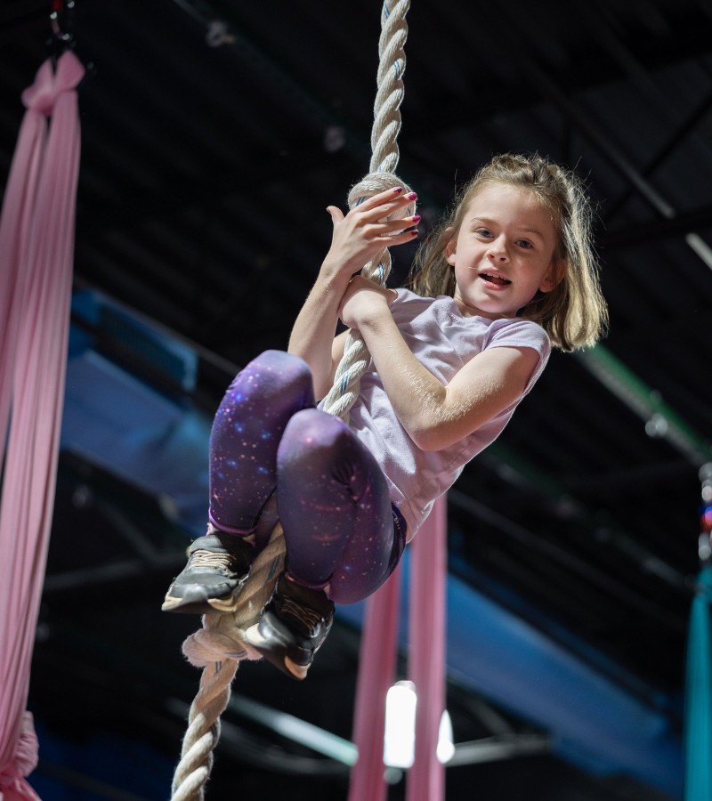 a kid uses a rope for kids gymastics at a londonderry gym near me