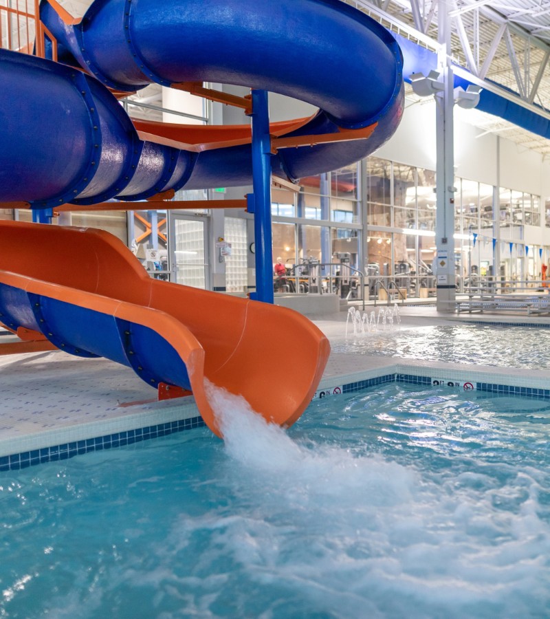 a water slide at the indoor aquatics center at the workout club gym near me in new hampshire